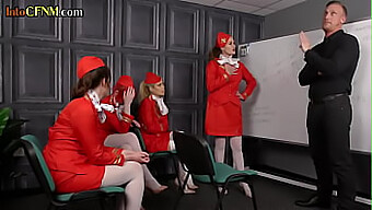 A group of female flight attendants performing oral sex on a man in a BDSM scenario