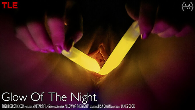 A tantalizing blonde indulges in inserting glowsticks into her intimate areas